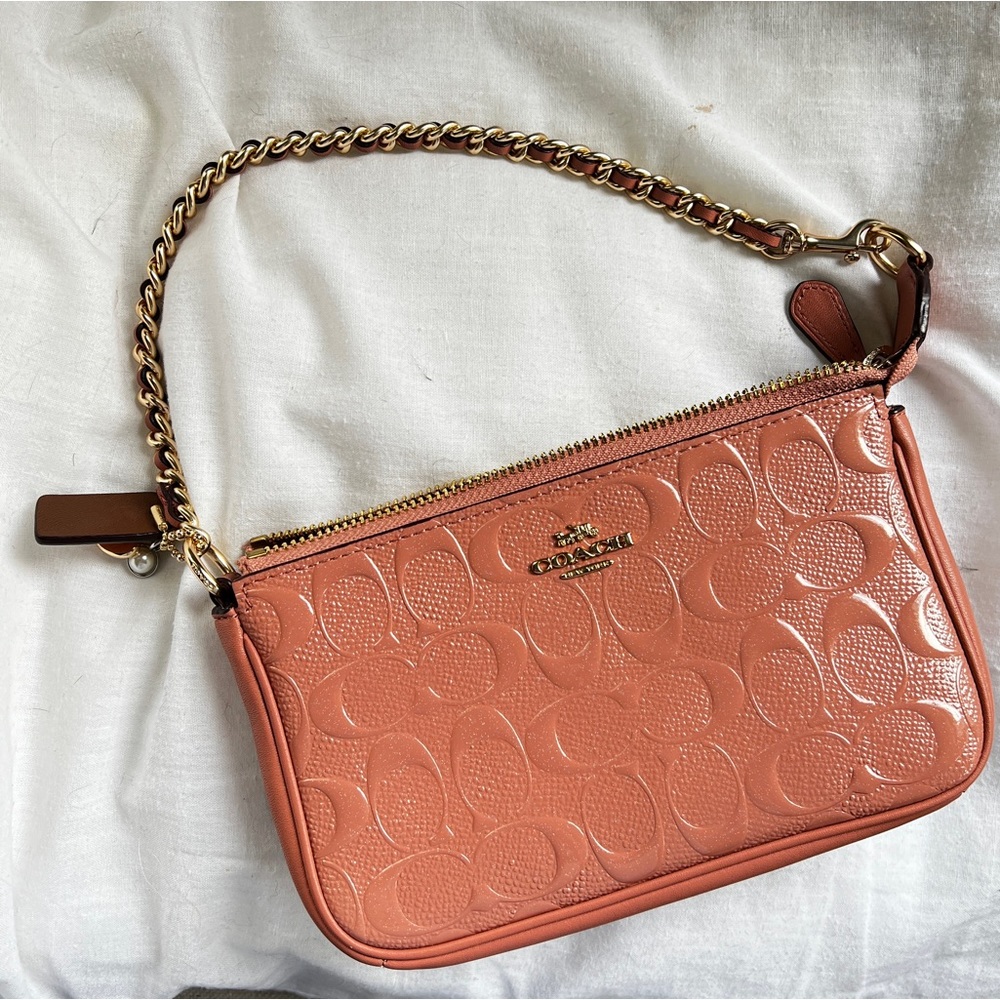 Coach purse with gold chain. Peach/pink embossed leather.
